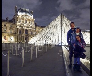 Stop by The Louvre at night for a breathtaking photo op with kids in Paris