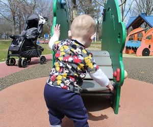 boy at playground at Eisenhower Park 