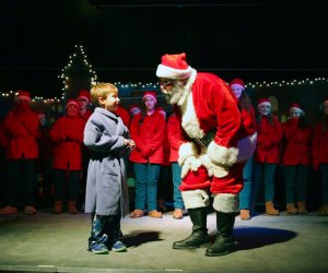 Photo of boy with Santa at Christmas Train Rides in New England.