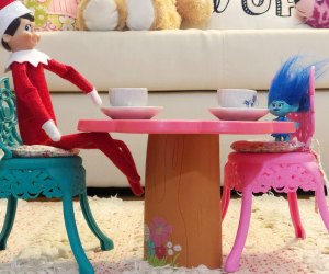 Elf on the Shelf has a tea party with other dolls