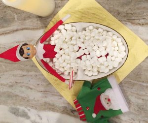 Elf on the Shelf takes a dip in a marshmallow bath