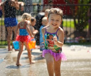 Photo of child running through splash pad at Longbrook Park, Stratford, CT