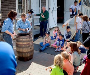 Kids can enjoy a historical re-enactment at the Mystic Seaport during a family-friendly weekend getaway to the town