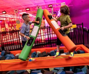 kids battle with foam at trampoline park