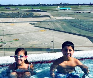 Cool hotel pools in New York: Two kids in the pool at the TWA Hotel