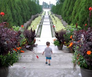 Boy walks through Untermyer Gardens where admission is free