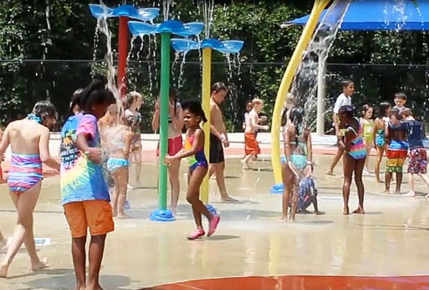 Delight in the soaking poles at East Roswell Sprayground.