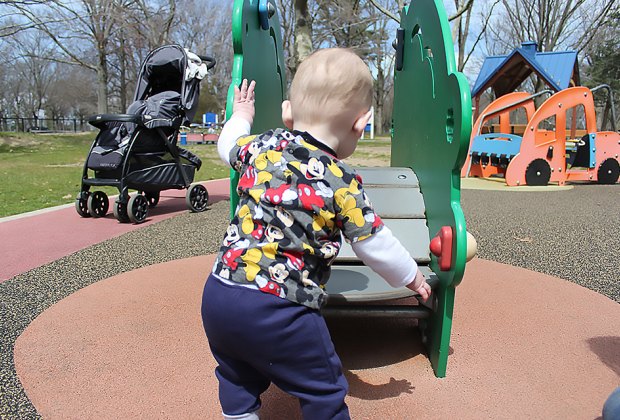 boy at playground at Eisenhower Park 