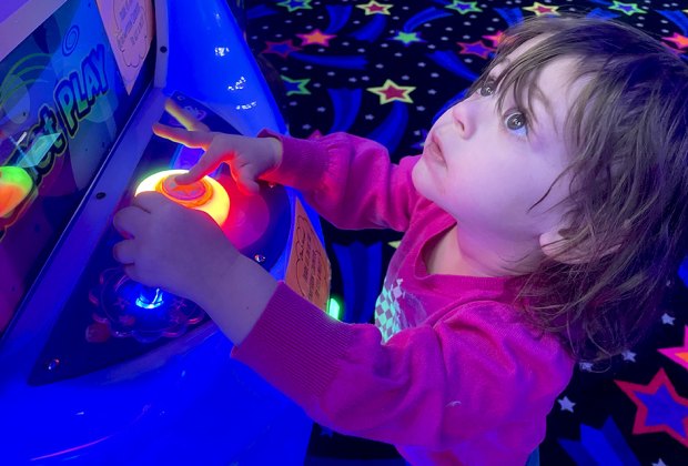 Toddlers love the bright lights of the arcade at Planet Play in Bellmore. Photo by Gina Massaro